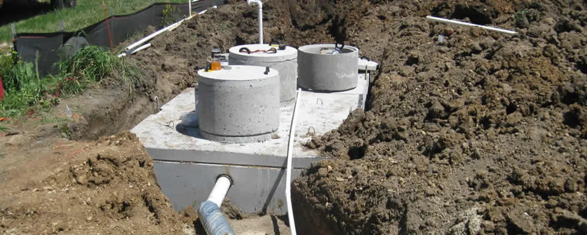 Septic system repair and installation site with tank access ports in Newton, MA